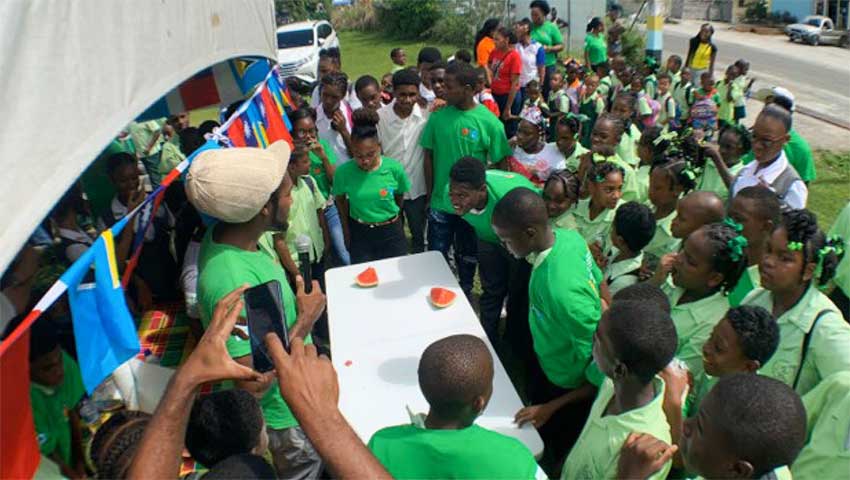 Image: Students engaged in an activity at the Farmer’s Market. 