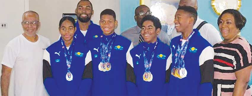 Image: Photo moment for Team Saint Lucia with Sports Minister - Edmund Estaphane and DPS - Liota Charlemagne - Mason. (PHOTO: SM)