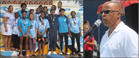 Image: Southern Flying Fish President Vicky Henry standing first from left (back row) with some members of her swim club; SLAF President Eddie Hazell. (PHOTO: Anthony De Beauville)