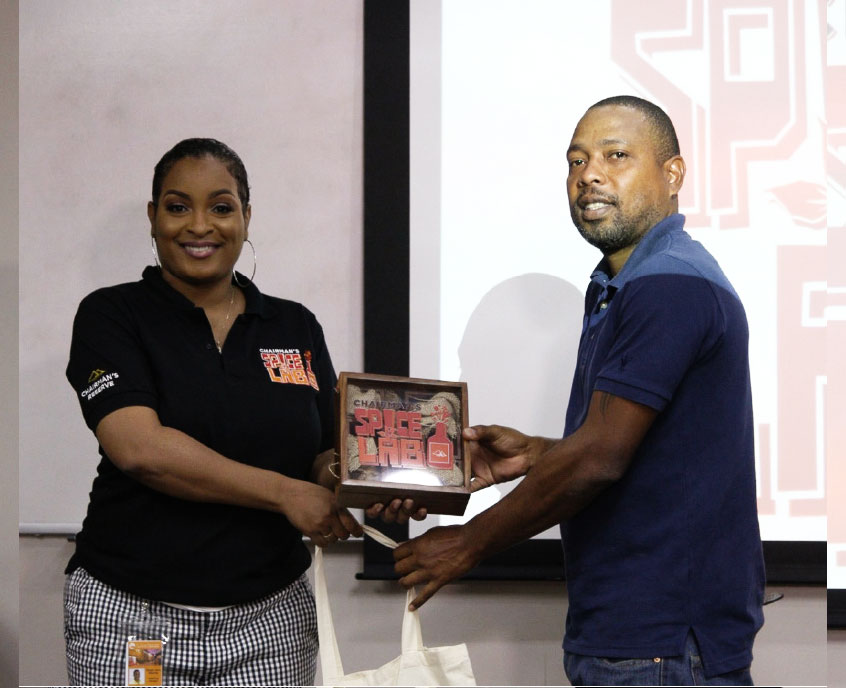 Image: Bartenders collectiing their spices from Sergin John Baptiste.