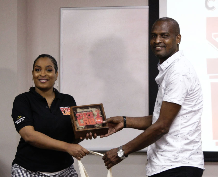 Image: Bartenders collectiing their spices from Sergin John Baptiste.
