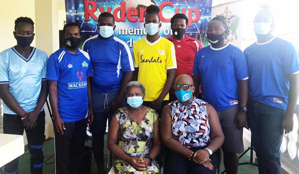 Image: FRONT ROW – Photo moment for Linda Charlery (Andre’s Mother) and Parliamentary representative for Micoud North, Dr. Gale Rigobert; (BACK ROW) representatives from the participating teams. (PHOTO: ZG)