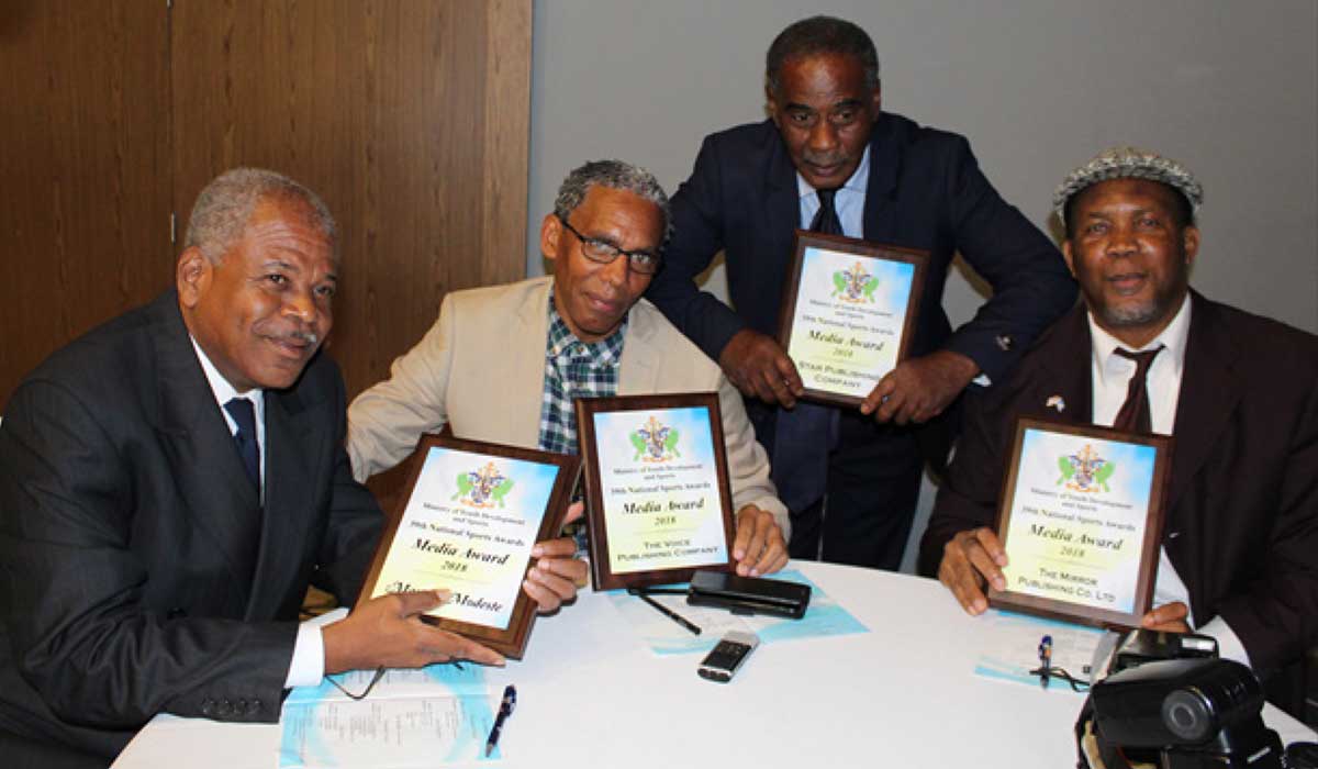 Image: L-R: Marius Modest (freelance), Anthony De Beauville (The VOICE); Dave Pascal (The Star) and Regional Andrew (The Mirror) hoping the New Year will start on a good note for all sportsmen and sportswomen. (PHOTO: Anthony De Beauville)