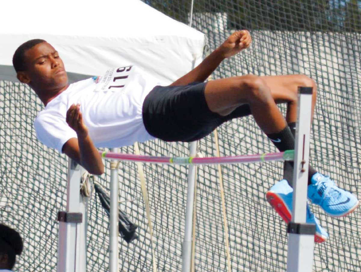 Image: A young aspiring high jumper waiting with anticipation. (Photo: Anthony De Beauville)