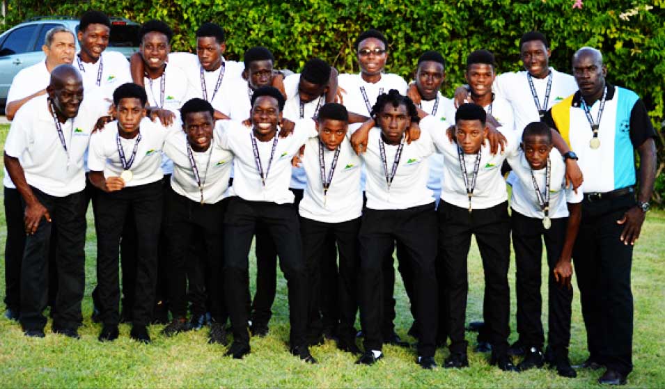 Image: A photo moment for Albert ‘Vasso’ St.Croix standing first from left with members of the victorious National Under 15 team. (PHOTO: Anthony De Beauville) 
