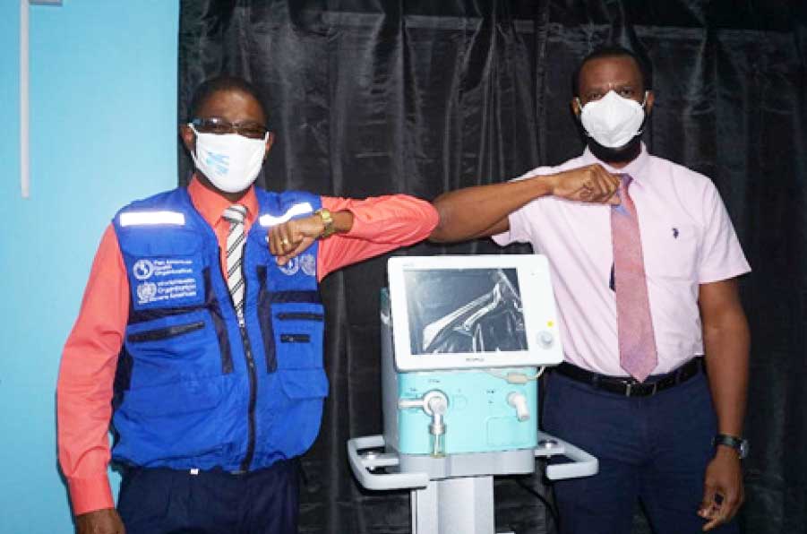Image: Right: Mr. Benson Emile, Permanent Secretary, Department of Health and Wellness, Left: Mr. Reynold Hewitt, PAHO Country Programme Specialist 