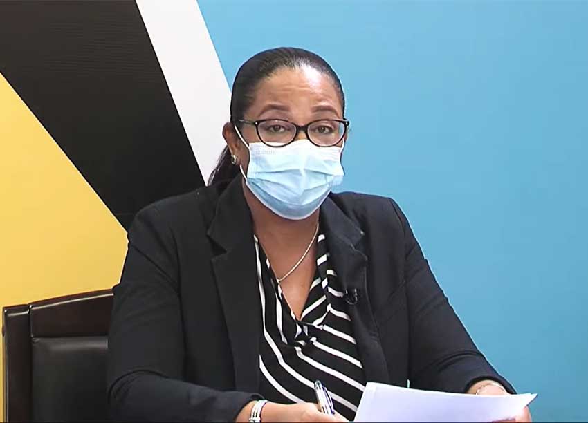 A masked Chief Medical Officer, Dr. Sharon Belmar –George