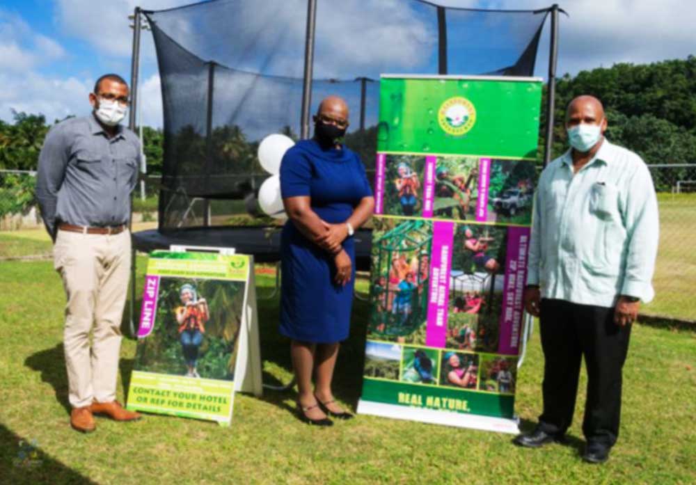 Image of From L-R, Raymond, Education Minister Rigobert and District Rep. Joseph.