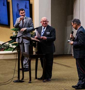 Image: Geoffrey Jackson (center), a member of the Governing Body, during the release program for the ASL Bible on February 15, 2020