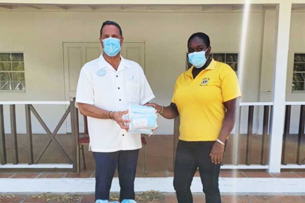 Image of Zone Chair receiving Donation of Masks.