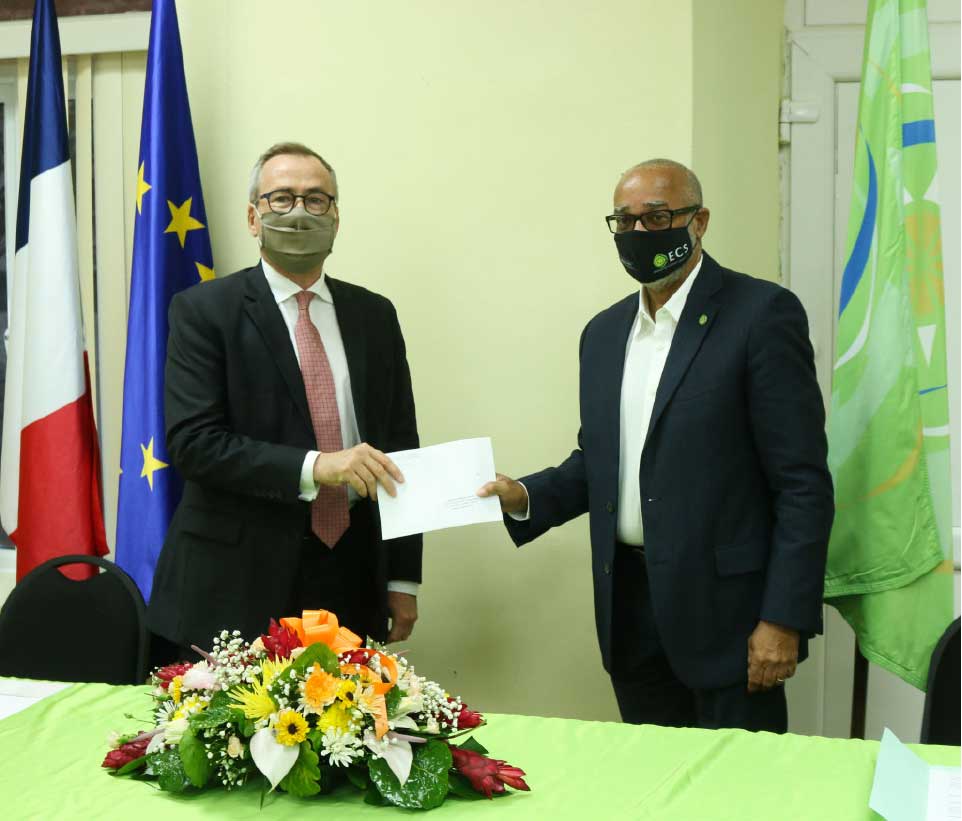 Image: H.E. Jacques-Henry Heuls presenting his Letters of Credence to Dr. Didacus Jules, Director General of the OECS