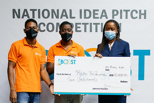 Image of Christan Tanner (far left) and Kayode James (centre) of Real 3D Printing were presented with the winning cheque for the National Idea Pitch Competition by Sophia Henry, permanent secretary in the Ministry of Commerce, International Trade, Investment, Enterprise Development and Consumer Affairs.