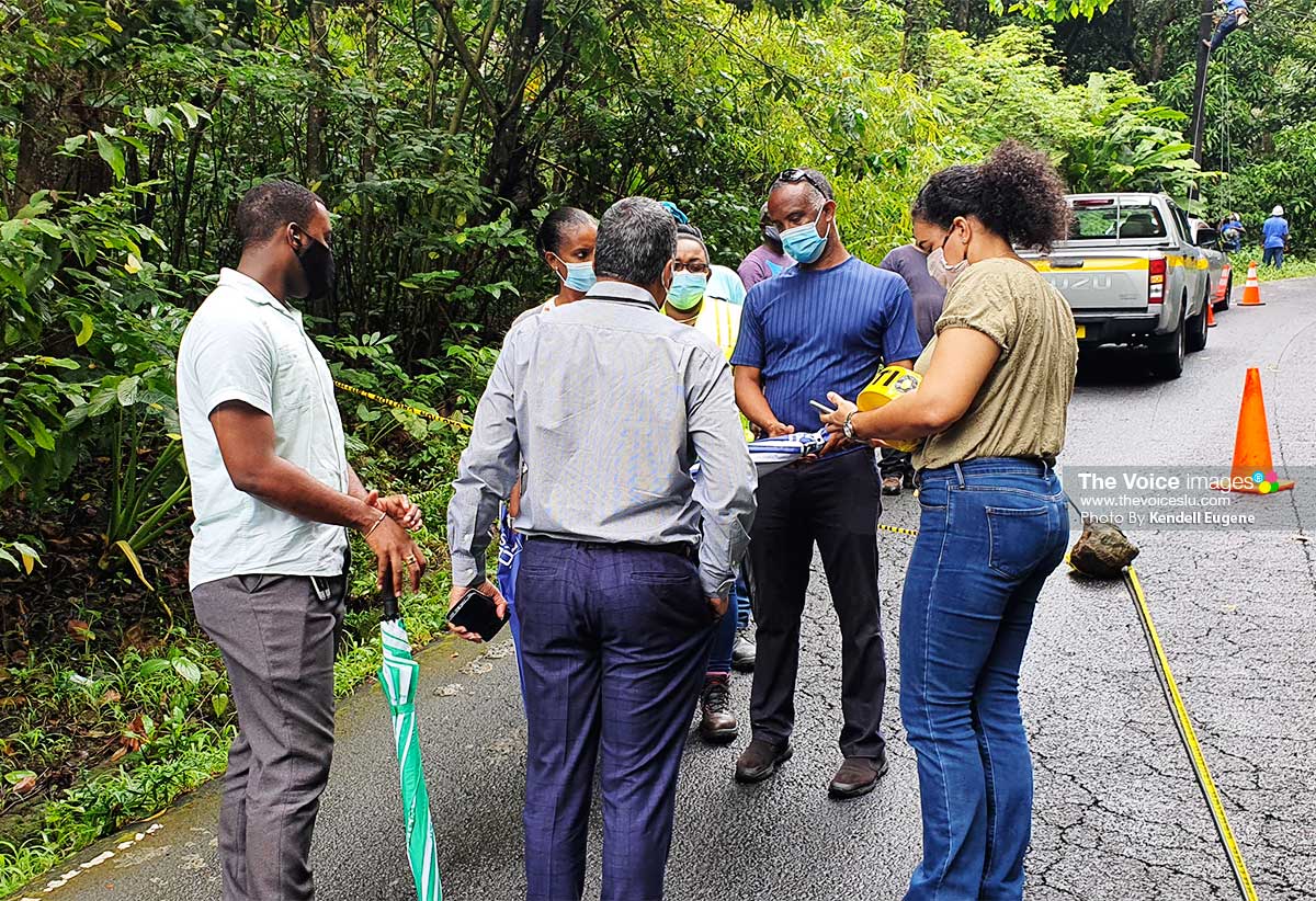 Image of Minister Joseph speaks with officials on road status