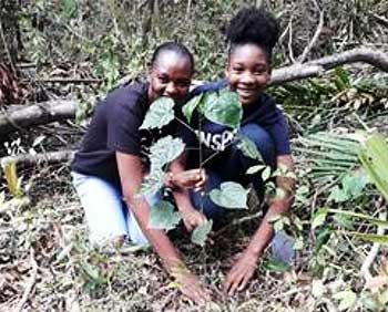 Image: [L-R] Sandals Foundation Ambassador, Samantha McPherson and teen volunteer Kayla Farquharson plant timber trees as part of conservation efforts to celebrate Earth Day 2019.