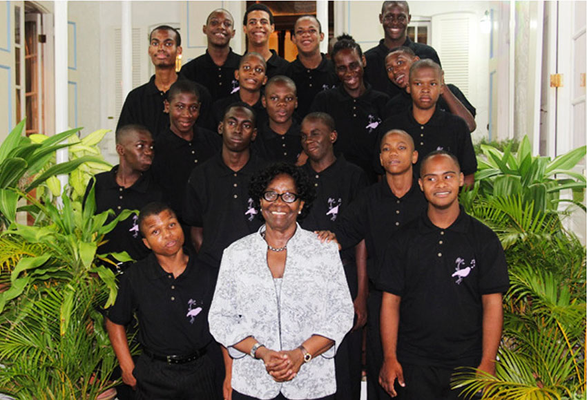 Dame Pearlette Louisy with the band members from the Dunnottar School and the Boys Training Centre.
