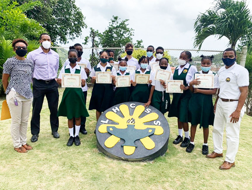 Photo moment for Resident Instructor, Sensei Kara - Lee Emmanuel -Theobalds, Sensei Karim Sifflet, students and LHCSS Principal, Rohan Lubon. (Photo: SKIF Saint Lucia) 