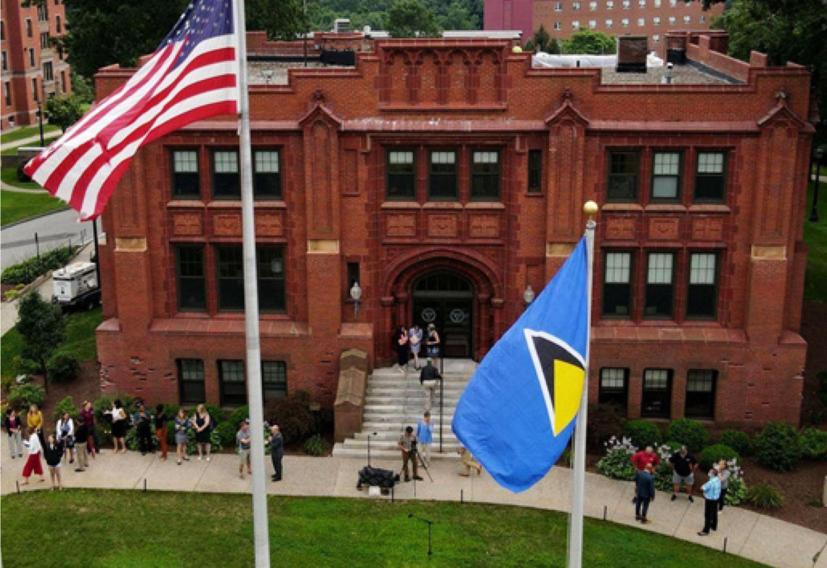 The Saint Lucia National Flag alongside the USA National Flag at Springfield College on Alden Street. (Photo: SFC)