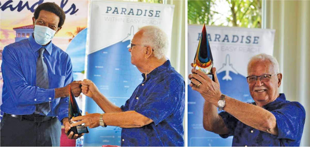 President of Saint Lucia National Cricket Association, Carol Henry presenting Perreira with a token; ‘Reds’ 50 and counting. (Photo: Anthony De Beauville)