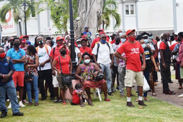 Crowd outside parliament building watching the swearing in of cabinet ministers Thursday.