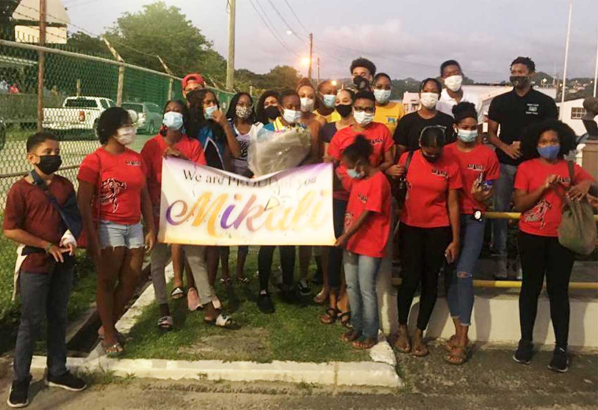 Sharks Swim Club came out in the numbers to welcome their club member and Olympian Mikaili Charlemagne. (Photo: SLAF)