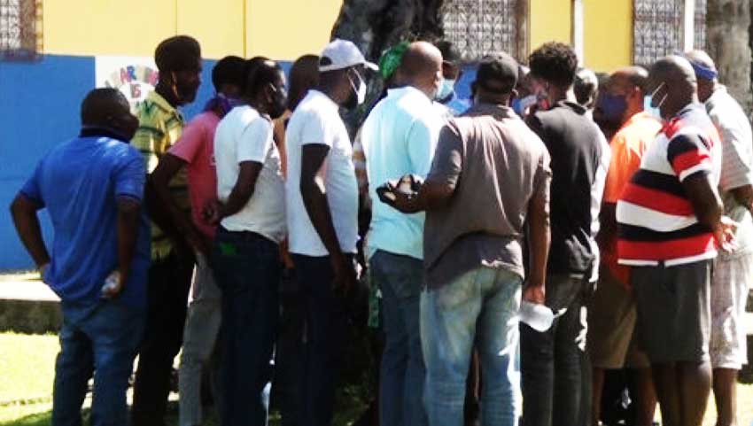 Bus drivers in a huddle.