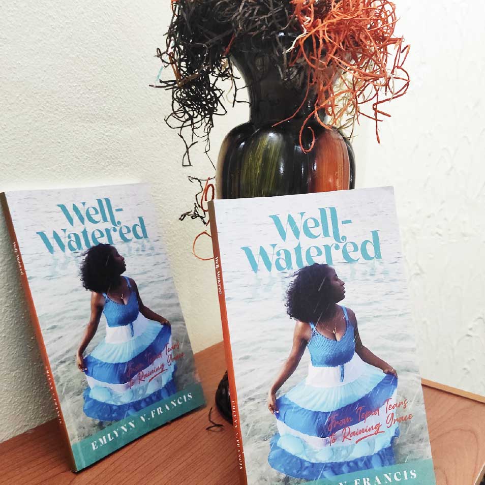 Two copies of "Well-watered", a novel by Emlynn Francis