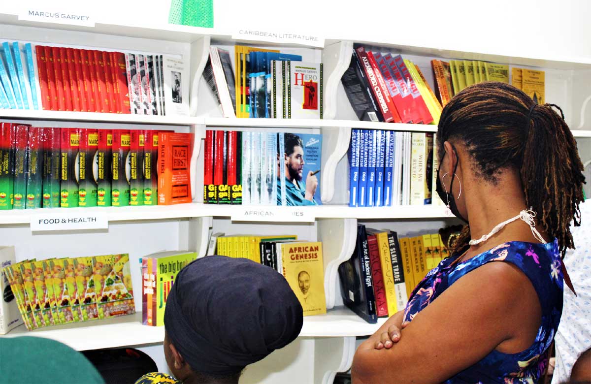 Attendees at the official launch browse through the book store.