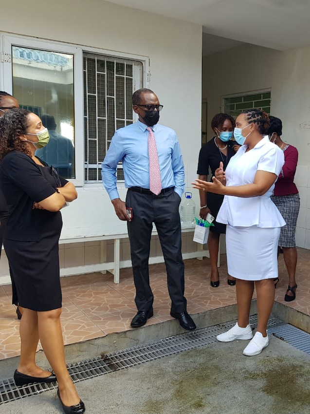 Prime Minister Philip Pierre (second from left) speaking to staff at the National Mental Wellness Centre to understand the challenges for space and conditions.