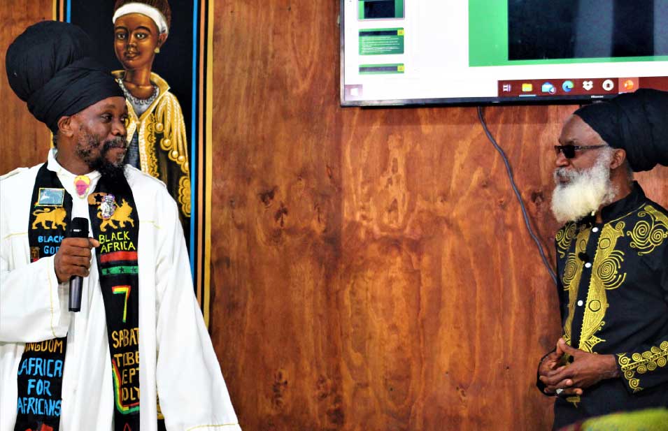 The Right Honourable Priest Kailash Leonce, left, and Ras Dr. Wayne Rose, right, at the official launch.