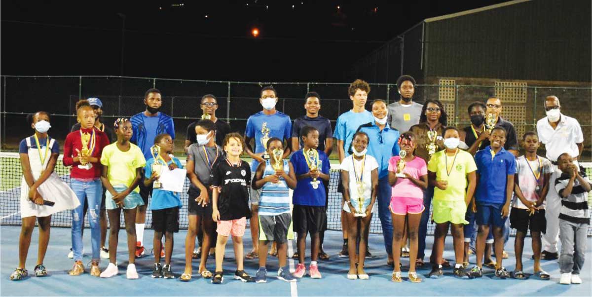 Picture moment as local tennis players celebrate their respective wins, Christmas Tennis Classic 2021. (Photo: Anthony De Beauville) 