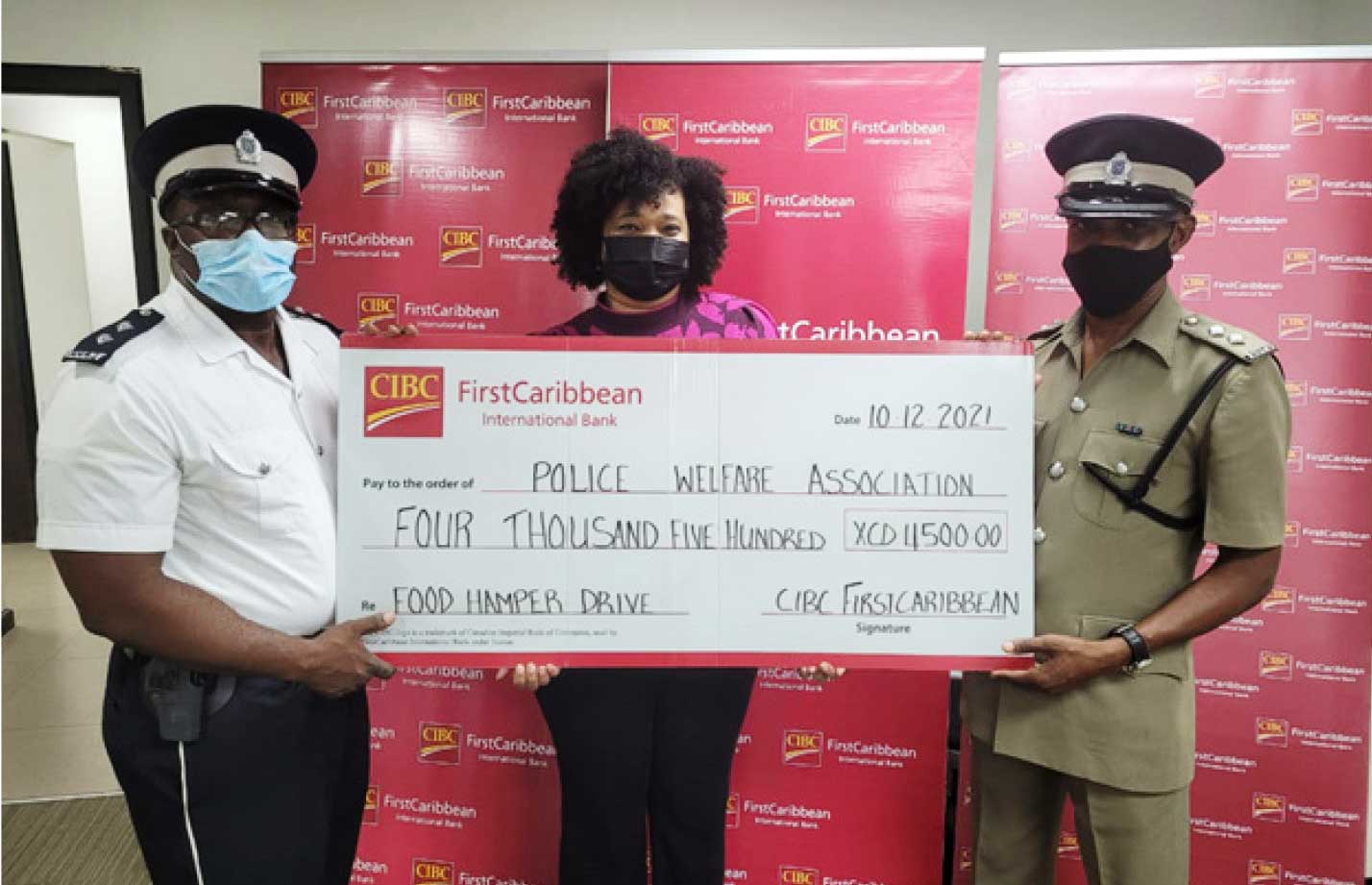 CIBC presents cheque to executives of the RSLPF Welfare Association towards 13 annual care drive.