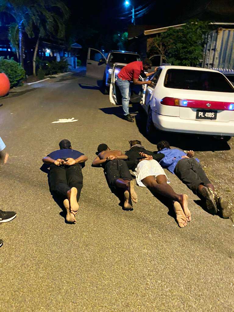 Handcuffed suspected restaurant burglars in custody