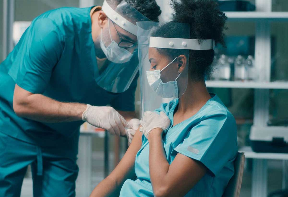 Vaccination, testing of symptomatic individuals, and ensuring health workers are among first in line for additional vaccine doses are key to safeguard health systems.