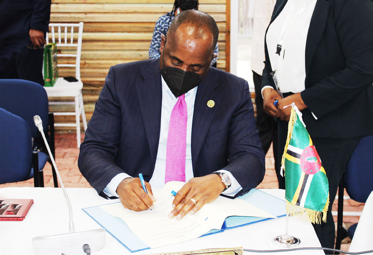 Dominica signing the protocol.