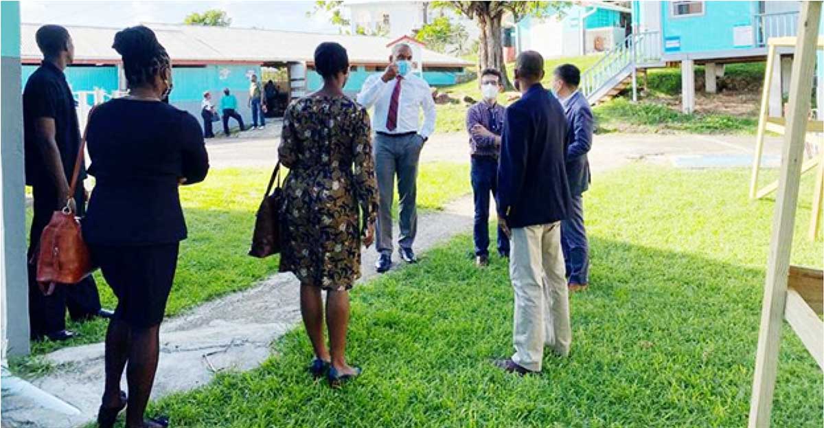 Officials tour the BTC compound