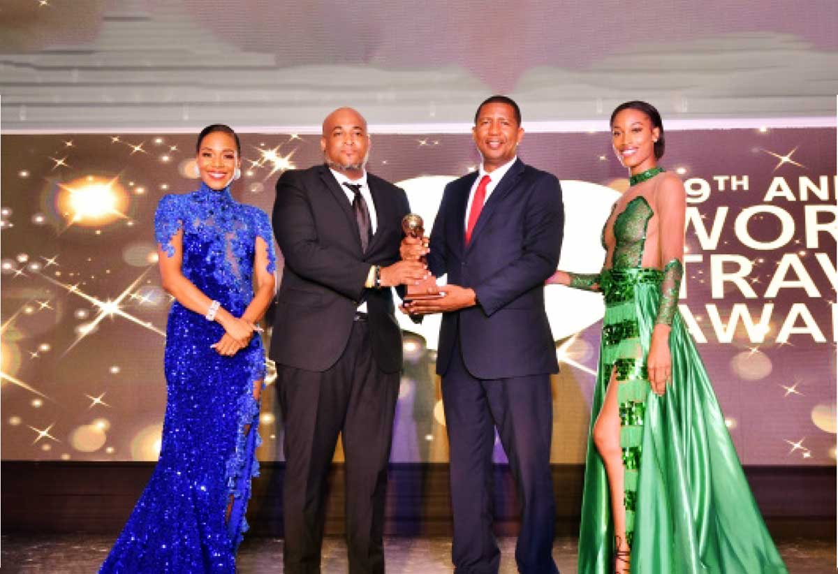 Hon. Guibion Ferdinand and Christopher Gustave SLTA Receiving Award for Caribbean Adventure Tourism 2022.