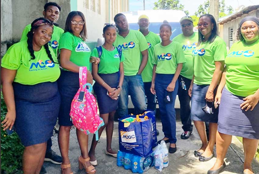 M&C Caring In Action volunteers distributing supplies in Anse La Raye