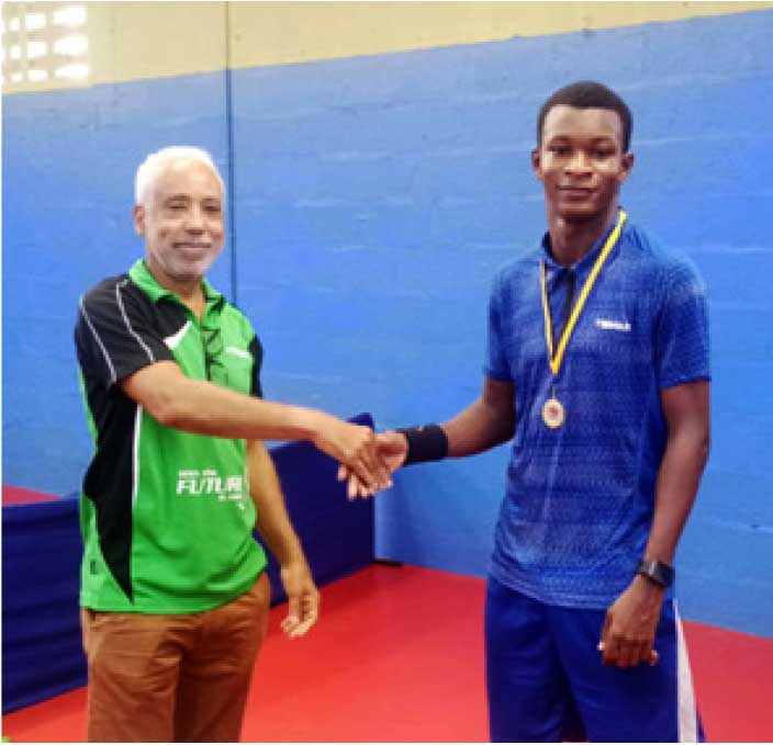 National Men's Singles champion De Andre Calderon (at right).