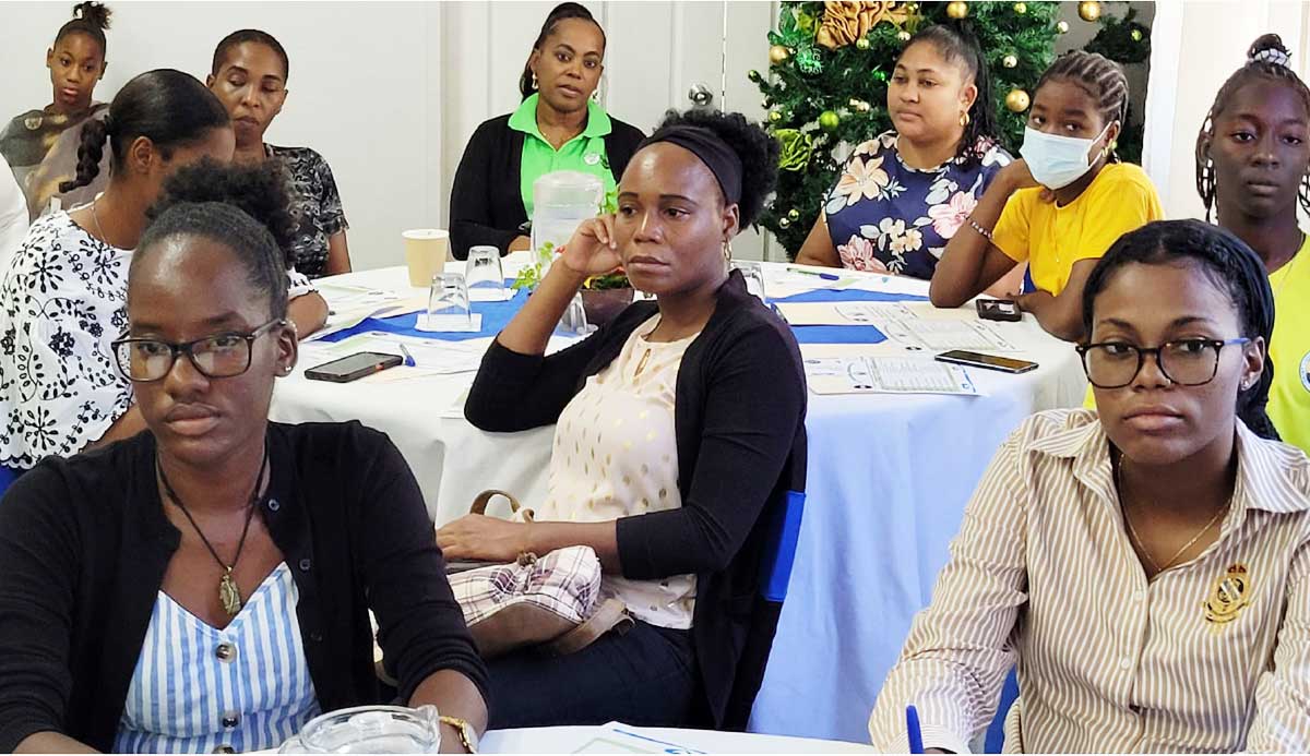 Young participants and officials at the women’s football conference. 