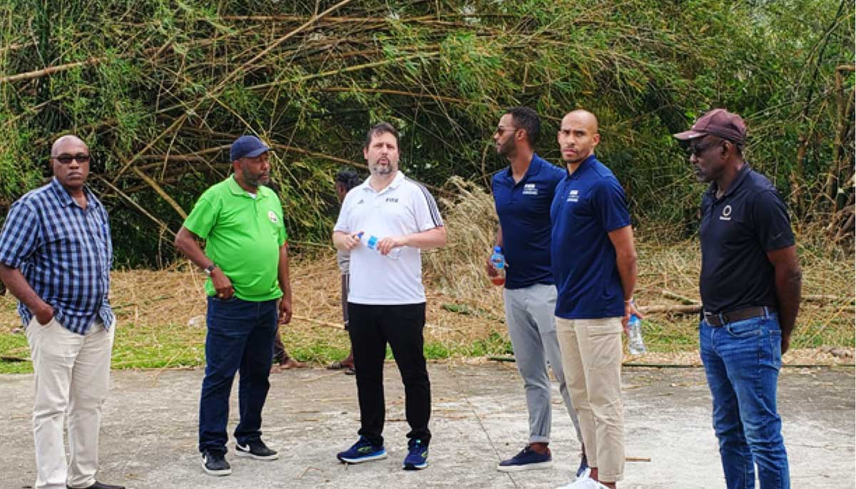 FIFA and SLFA reps assess turf facilities. 