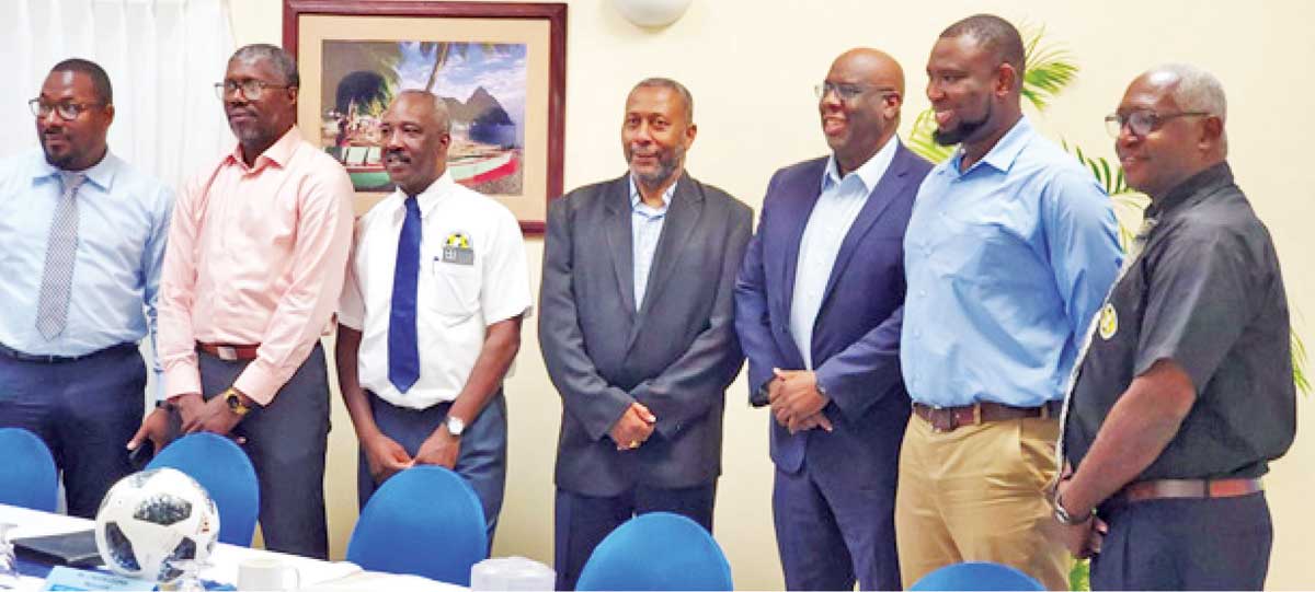 SLFA President Lyndon Cooper (centre) alongside official Howard Mc. Intosh (right) and other SLFA executive officers.