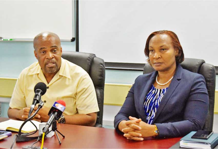 Social Justice Minister Joachim Henry (left) and Permanent Secretary Velda Joseph.