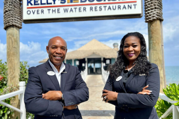 General Manager Filius Laurent and Hotel Manager Rohann Louis on Saint Lucia's Sandals Halcyon's famous over-the-water dockside restaurant at Choc. (PHOTO Courtesy SRI)