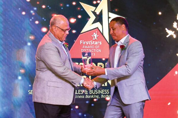 Christopher McFarlane’s star shone extra brightly on the night as he received the prestigious CEO’s Award of Distinction from CIBC FirstCaribbean’s Chief Executive Officer Mark St. Hill.