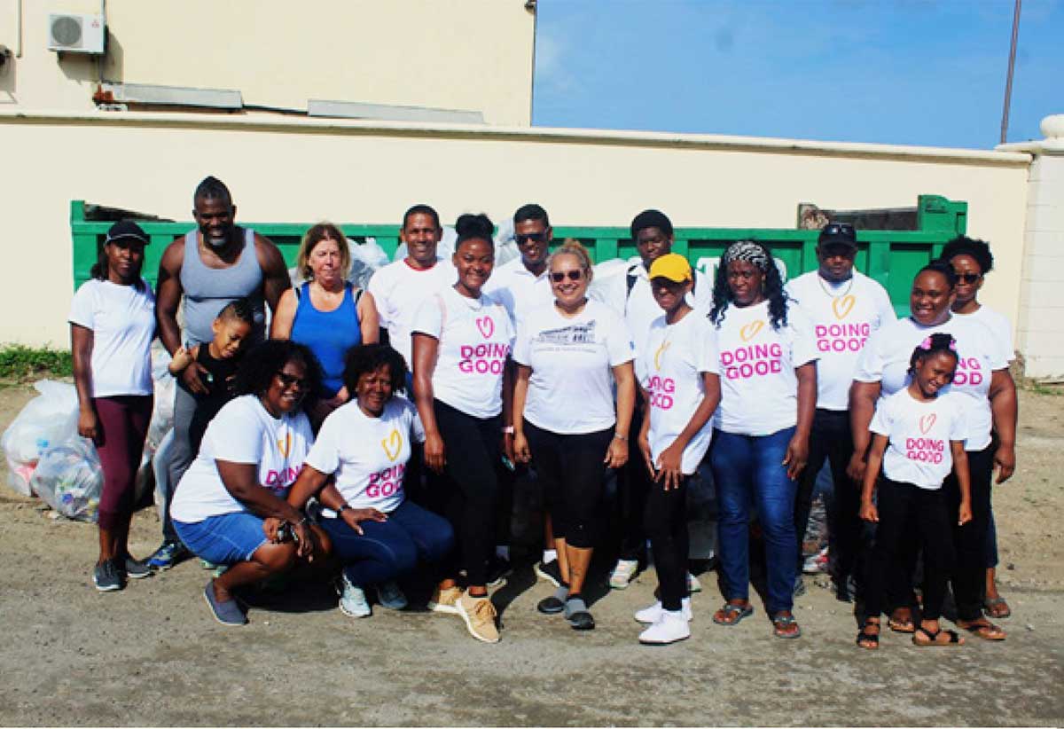 Staff from The Landings Resort & Spa, volunteers from Do-Nation Foundation, and visitor Janet Royce, following the clean-up exercise.