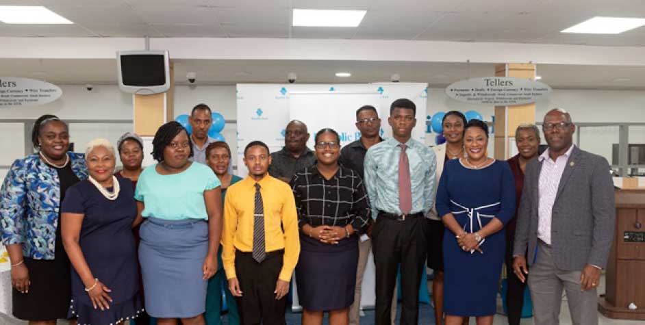 Left to right: Gezella Claxton: Senior Country Lead, Michelle Palmer: Managing Director, YouthLinkers and family, and other members of the executive leadership team.