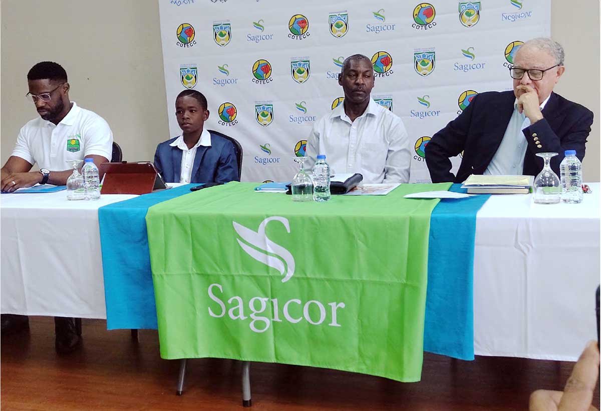 L-R Sherlon Leon Sagicor Sales Manager, Ahil Cyril Under-12 champion, Jim Xavier Director of Sports and Dr Stephen Mc. Namara SLTA Presidemt.