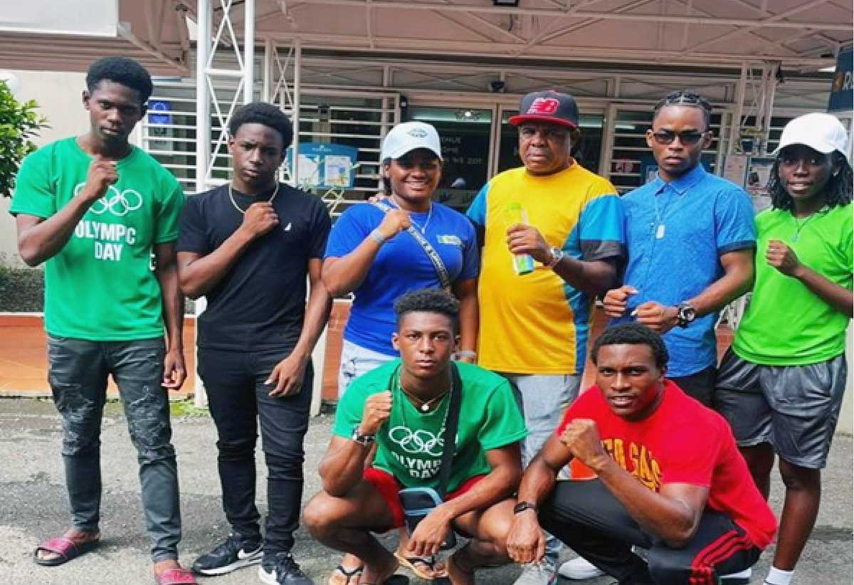 The seven boxers from Saint Lucia with coach Conrad Fredericks in Martinique. 