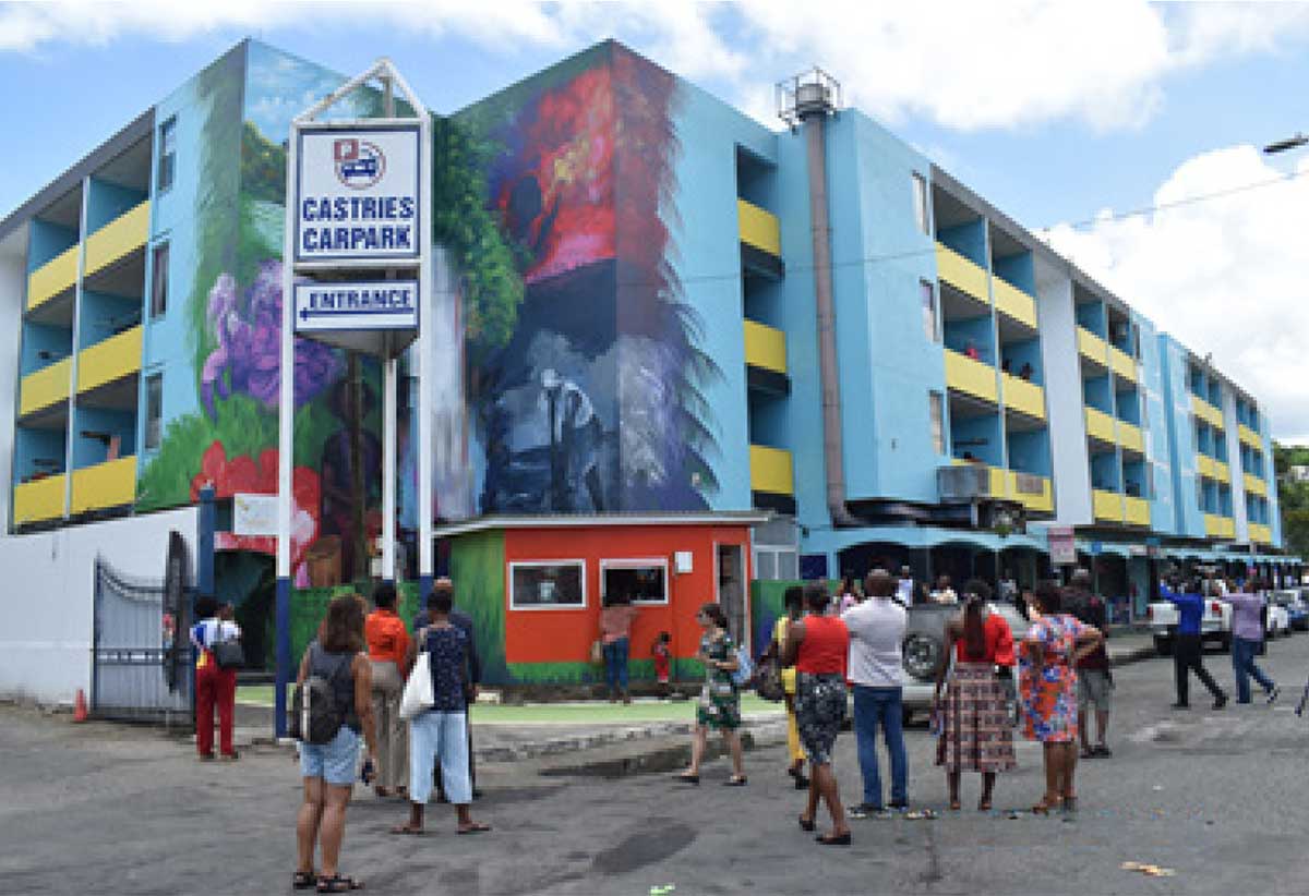 Alwyn St. Omer’s mural “illustrates symbols of Saint Lucia’s compellingly beautiful landscape and the people of her ancestral past…”