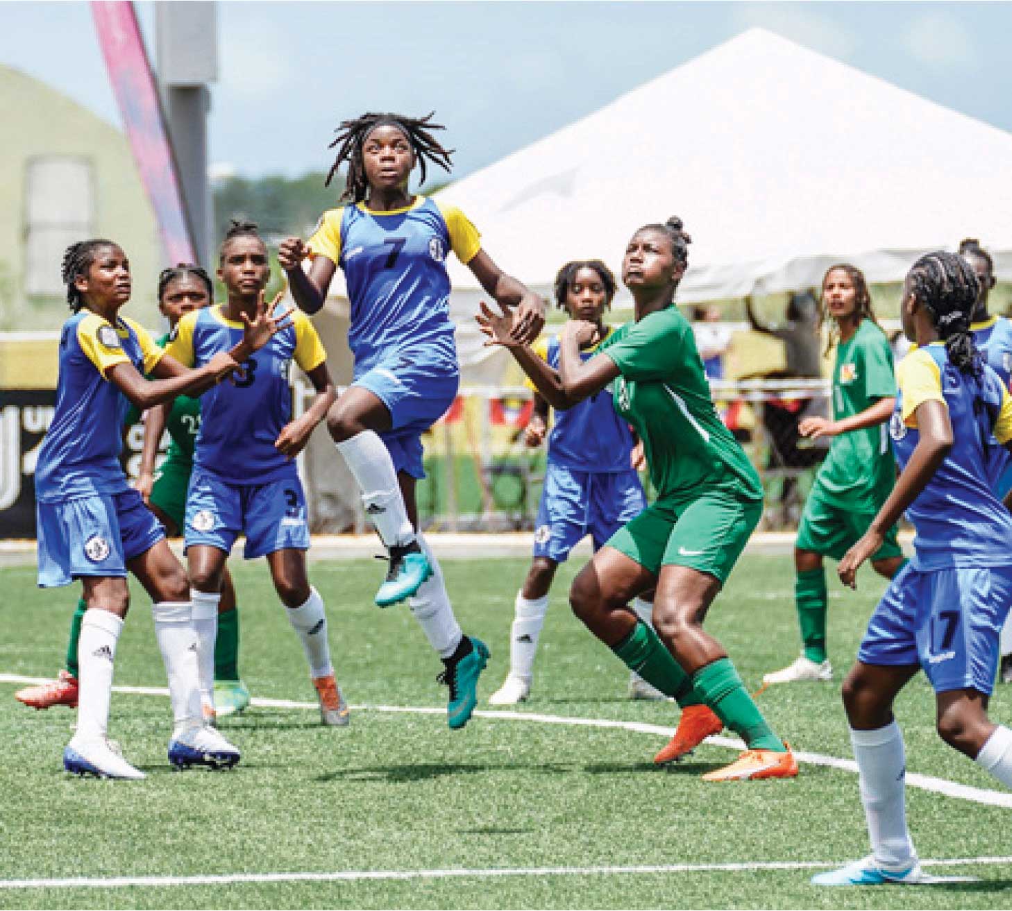 Team Saint Lucia (blue and yellow outfit) in an offensive mode versus Guadeloupe 